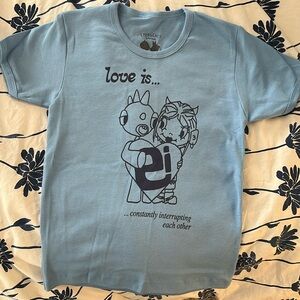 Emergency Intercom merch, blue “Love is…” baby tee size medium